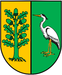herb przedzielony na pół, żółto zielony, z prawej strony czapla siwa, z lewej drzewo
